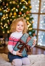 Little girl holding christmas gift box Royalty Free Stock Photo