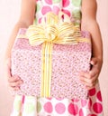 Little girl holding christmas gift box in the foreground Royalty Free Stock Photo