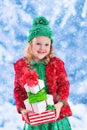 Little girl holding Christmas presents Royalty Free Stock Photo