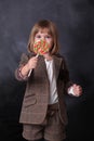 Little girl holding a colorfull lollipop. Little child with sweets. Happy candy girl Royalty Free Stock Photo