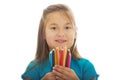 Little girl holding crayons