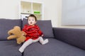 Little girl holding doll bear Royalty Free Stock Photo