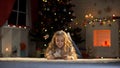 Little girl holding envelope with letter for Santa, belief in X-mas magic