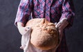 Little girl holding freshly baked crusty homemade ciabatta bread