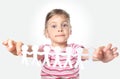 Little girl holding garland of paper little people