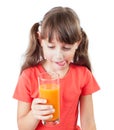 Little girl holding a glass of juice