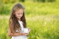 Little girl holding glass of milk outdoor summer Royalty Free Stock Photo