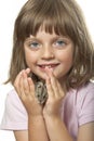 Little girl holding hamster