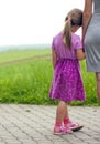 Little girl holding a hand of her mother. Family relations conce Royalty Free Stock Photo