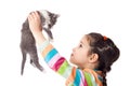 Little girl holding in hands adorable kitten Royalty Free Stock Photo