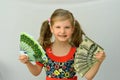 Little girl holding in hands a pack of dollars and Euro Royalty Free Stock Photo