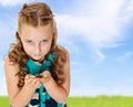 Little girl holding in hands a small turtle. Royalty Free Stock Photo