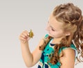 Little girl holding in hands a small turtle. Royalty Free Stock Photo