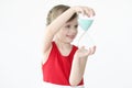 Little girl holding hourglass in her hands Royalty Free Stock Photo