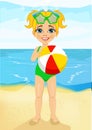 Little girl holding an inflatable striped ball at the beach