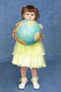 Little girl holding a large globe Royalty Free Stock Photo