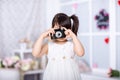 Little girl holding an old camera Royalty Free Stock Photo