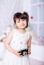 Little girl holding an old camera Royalty Free Stock Photo