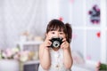 Little girl holding an old camera Royalty Free Stock Photo