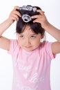 Little girl holding an old camera Royalty Free Stock Photo