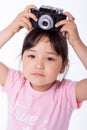 Little girl holding an old camera Royalty Free Stock Photo