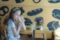 Little girl holding a paper bag with food in her hands Royalty Free Stock Photo