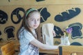 Little girl holding a paper bag with food in her hands Royalty Free Stock Photo