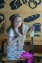 Little girl holding a paper bag with food in her hands Royalty Free Stock Photo