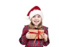 Little girl holding present box isolated on white. Child in christmas hat,costume with gift in hands Royalty Free Stock Photo