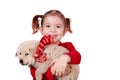 Little girl holding puppy
