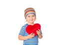 Little girl holding a red heart toy. Royalty Free Stock Photo