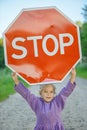 Little girl holding a red sign Royalty Free Stock Photo