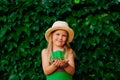 Little girl holding sprout in a soil Royalty Free Stock Photo