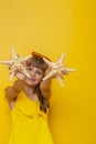 Little girl holding starfish Royalty Free Stock Photo