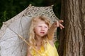 Little girl holding sunshade