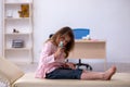 Small girl holding syringe waiting for doctor in the clinic Royalty Free Stock Photo