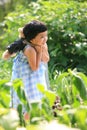 Little girl holding teddy bear in her back Royalty Free Stock Photo