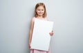 Little girl holding vertical empty placard