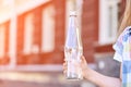 Little girl holding water bottle. Outdoor training. Thirsty. Glass drink Royalty Free Stock Photo