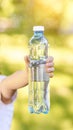 Little girl holding water bottle. Outdoor training. Thirsty Royalty Free Stock Photo