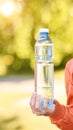 Little girl holding water bottle. Outdoor training. Thirsty Royalty Free Stock Photo