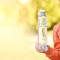 Little girl holding water bottle. Outdoor training. Thirsty Royalty Free Stock Photo