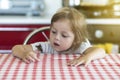 Little girl holds on the hand the Aglais io butterfly and watches for him, emotions Royalty Free Stock Photo