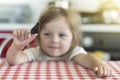 Little girl holds on the hand the Aglais io butterfly and watches for him, emotions Royalty Free Stock Photo