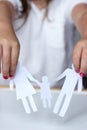 Little girl holds paper chain family; broken family Royalty Free Stock Photo