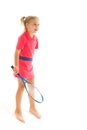 A little girl holds a tennis racket in her hands. Game, sports concept. Royalty Free Stock Photo