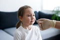 Little girl at home during taking obligatory rapid test showing Covid-19 virus Royalty Free Stock Photo