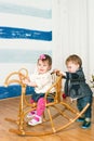 Little girl on a horse rocking chair Royalty Free Stock Photo