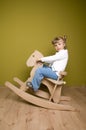 Little girl and horse - rocking chair Royalty Free Stock Photo