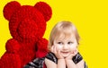 Little girl with a huge red bear Royalty Free Stock Photo